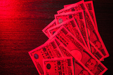 Japanese banknotes on dark backgroundの写真素材