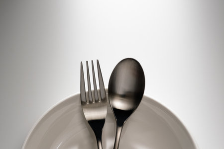 Fork and spoon on white backgroundの写真素材