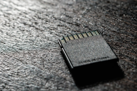 SD memory card on wooden tableの写真素材