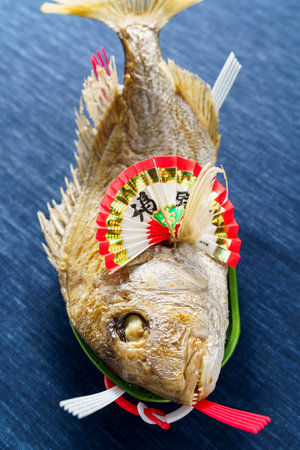 Whole grilled sea bream with saltの写真素材