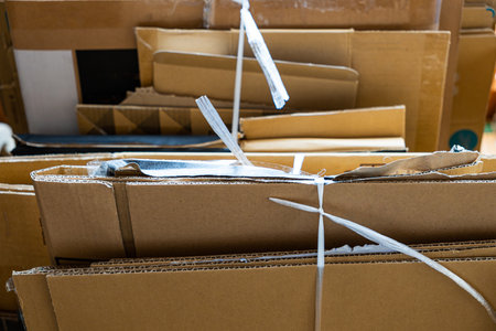 Cardboard boxes stacked in a roomの写真素材