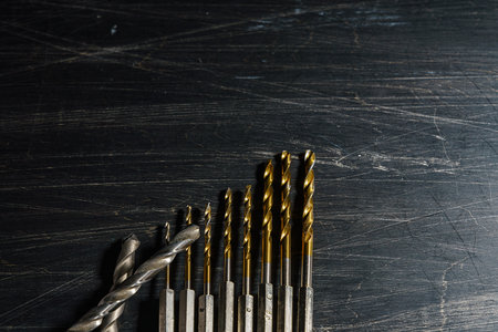 Drill bits on wooden tableの写真素材
