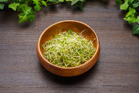 Broccoli isolated on wooden tableの写真素材