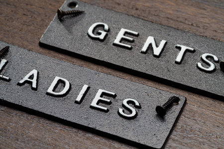 Restroom sign on wooden tableの写真素材