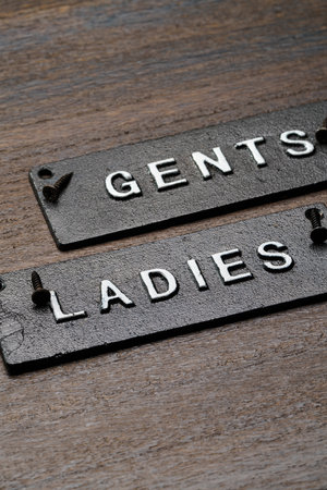 Restroom sign on wooden tableの写真素材