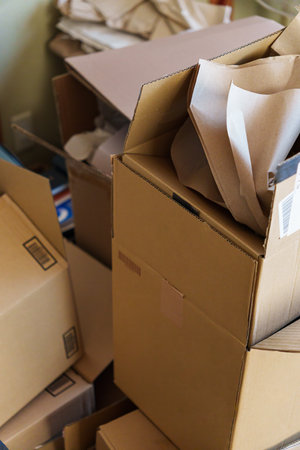 Cardboard boxes stacked in a roomの写真素材