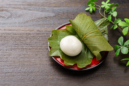 Japanese rice cake 'Kashiwa mochi' on wooden table