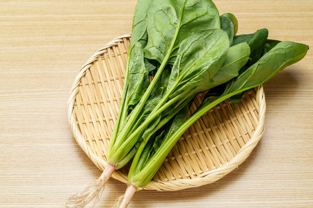 Fresh spinach on wooden tableの写真素材
