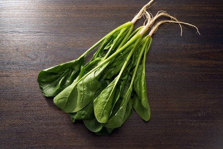 Fresh spinach on wooden tableの写真素材