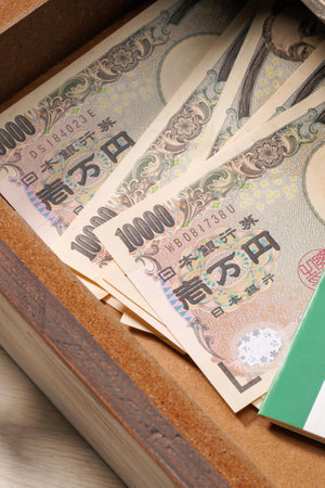 Japanese money and bankbook in a drawerの写真素材
