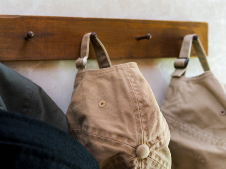 Casual Caps Hanging on Wooden Hooksの写真素材