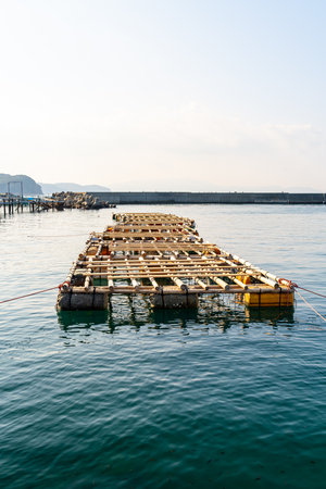 Floating Fish Farm Cage on the Calm Seaの写真素材