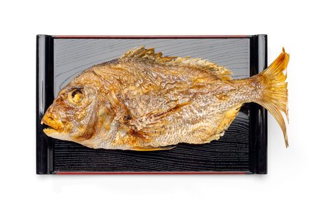 Whole Grilled Sea Bream Served on Traditional Japanese Tray for Celebration