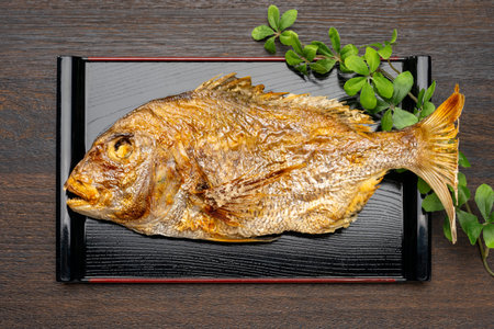 Whole Grilled Sea Bream Served on Traditional Japanese Tray for Celebration
