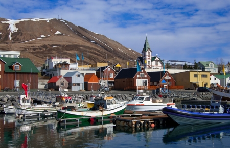 Icelandic Seaport: Boats for fishing and for whale watching tours gather at the port of Husavik, Iceland.の写真素材