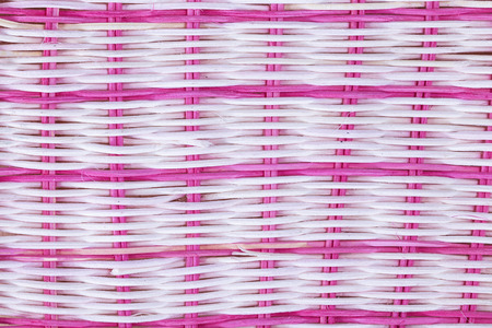 texture of a wattled basket of pink and white colorsの写真素材
