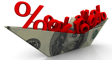 Paper boat from an American banknote with the symbols of a percentの写真素材