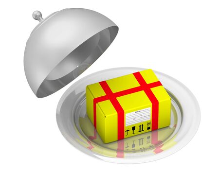 Yellow parcel lies on a plate with cap. Isolatedの写真素材