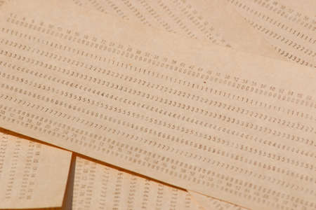 Background from computer punched cards. A lot of punched cards for old computersの写真素材