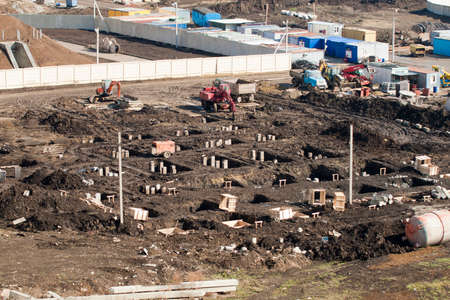 Construction site. The construction of the foundation supports. Construction machinery at the...