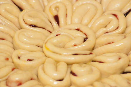 Piece of pie with fruit filling before baking. Close-up of a pie with fruit filling before baking in the oven. Homemade bakingの写真素材