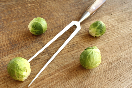 composition of fresh brussels sprouts on a wooden boardの写真素材
