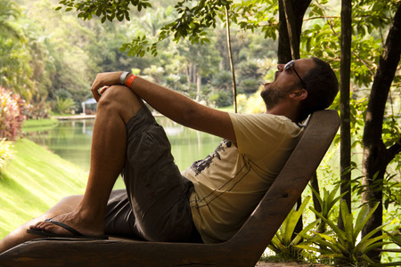 Young tired man in a park in Minas Gerais, Brazilの写真素材