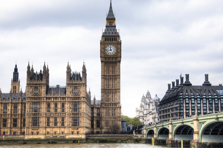 View from the Thames of the Houses of Parliament with the famous Big Ben tower and the Westminster...
