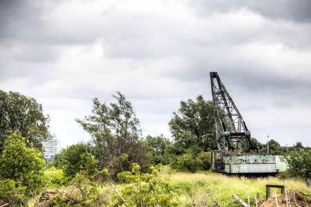 old crane at the docks of the Schelde river in the city of Antwerp in Belgiumの写真素材