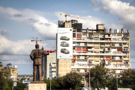 Statue of president Samora of Mozambique with appartment building in Maputo, the capital of...
