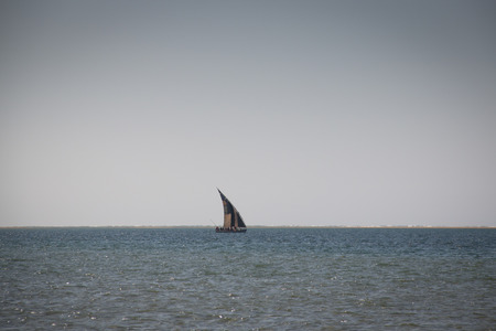 Typical boats called dhows near the coast of Barra and Praia do Tofo in Inhambane, Mozambiqueの写真素材