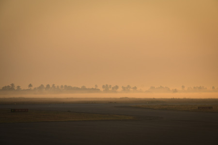 Sunrise with mist in the airport of Beira in Mozambiqueの写真素材
