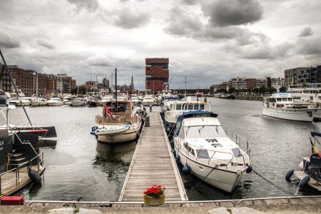 The yacht harbour in the city of Antwerp, Belgium with the MAS museum in the backgroundのeditorial素材