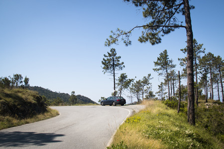 LIGURIA, ITALY - JULY 2016: Audi A4 car parked on a mountain road in the Liguria area in Italy with mountains in the backのeditorial素材