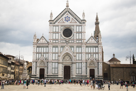 FLORENCE, ITALY - JULY 2016: Famous square with the Basilica di Santa Croce or Basilica of the Holy Crosswith people  in Florence, Italyのeditorial素材