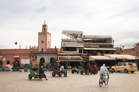 MARRAKESH, MOROCCO - DECEMBER 2016: People on the very busy main square of Marrakesh in Morocco called Jeema el Fna, with severel food and juice stands and all kinds of visitors and entertainersのeditorial素材