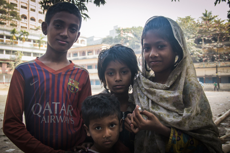 CHITTAGONG, BANGLADESH - FEBRUARY 2017: Children in the streets of Chittagong, the main port city of...