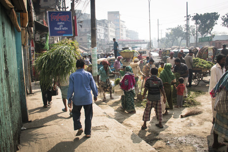 CHITTAGONG, BANGLADESH - FEBRUARY 2017: People selling herbs from a stand on the street in Dhaka, Bangladeshのeditorial素材