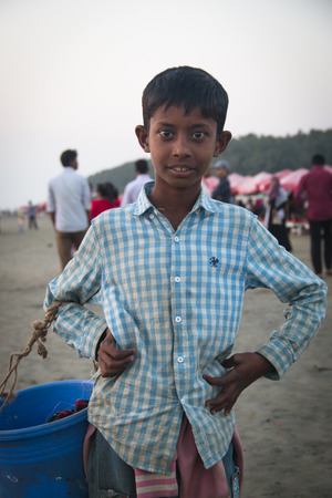 COX'S BAZAR, BANGLADESH - FEBRUARY 2017: Boy on the longest beach in the world in Cox's Bazar in Bangladeshのeditorial素材