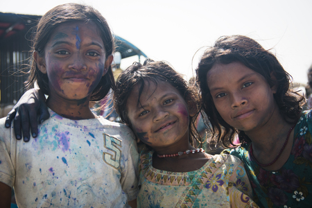 MAHESKHALI, BANGLADESH Ã¢ï¿½ï¿½ FEBRUARY 2017: Children covered in paint during a Hindu festival on Maheskhali Island, Bangladeshのeditorial素材
