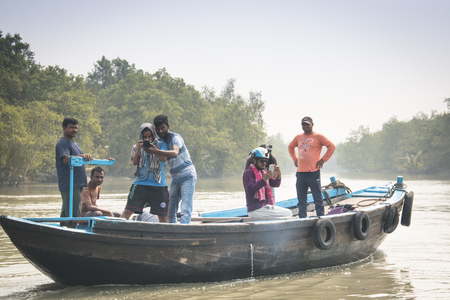 SUNDARBANS, BANGLADESH - FEBRUARY 2017: Film crew on a smal boat on a river in Sundarbans in Bangladeshのeditorial素材