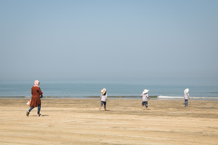 SAINT MARTIN'S ISLAND, BANGLADESH - FEBRUARY 2017: People on the longest beach in the world in Cox's Bazar in Bangladeshのeditorial素材