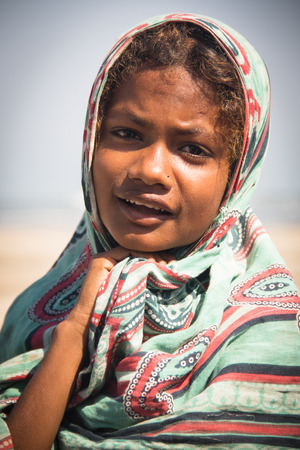 SAINT MARTIN'S ISLAND, BANGLADESH - FEBRUARY 2017: Girl on the beach in Saint Martin's island in Bangladeshのeditorial素材
