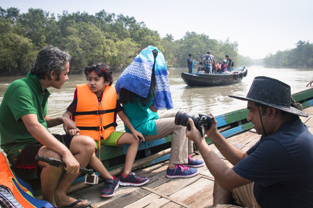 SUNDARBANS, BANGLADESH - FEBRUARY 2017: Film crew on a smal boat on a river in Sundarbans in Bangladeshのeditorial素材