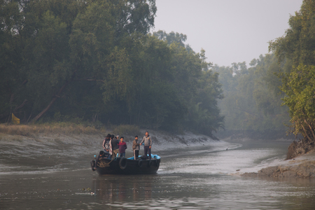SUNDARBANS, BANGLADESH - FEBRUARY 2017: Sunset over the river in the Sundarbans national park, famous for its Royal Bengal Tiger in Bangladeshのeditorial素材