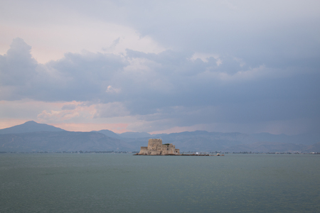 The Bourtzi water castle is a small island with a fortress at the coast of Nafplio in Greeceの写真素材