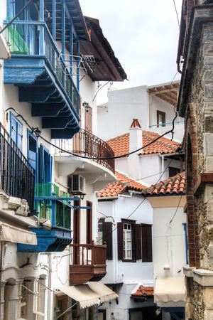 A typical street with historical houses in Skopelos town on Skopelos island in Greeceの写真素材