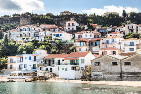 View over the bay with crystal clear water and typical houses in Koroni, Messinia, Greeceのeditorial素材