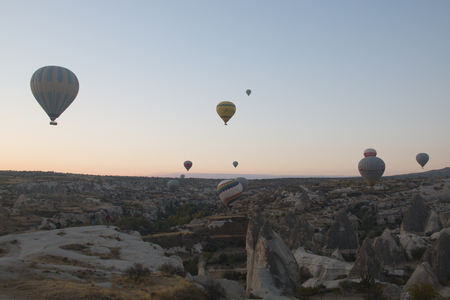 GOREME, TURKEY - OCTOBER 2017: Many hot air balloons fly every morning with tourists over Cappadocia in Turkeyのeditorial素材