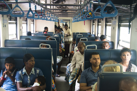 KANDY, SRI LANKA - DECEMBER 2017: People traveling in third class in the train between Kandy and Ella in Sri Lankaのeditorial素材